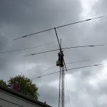 Gil, KM4OZH, taking down beam and tower